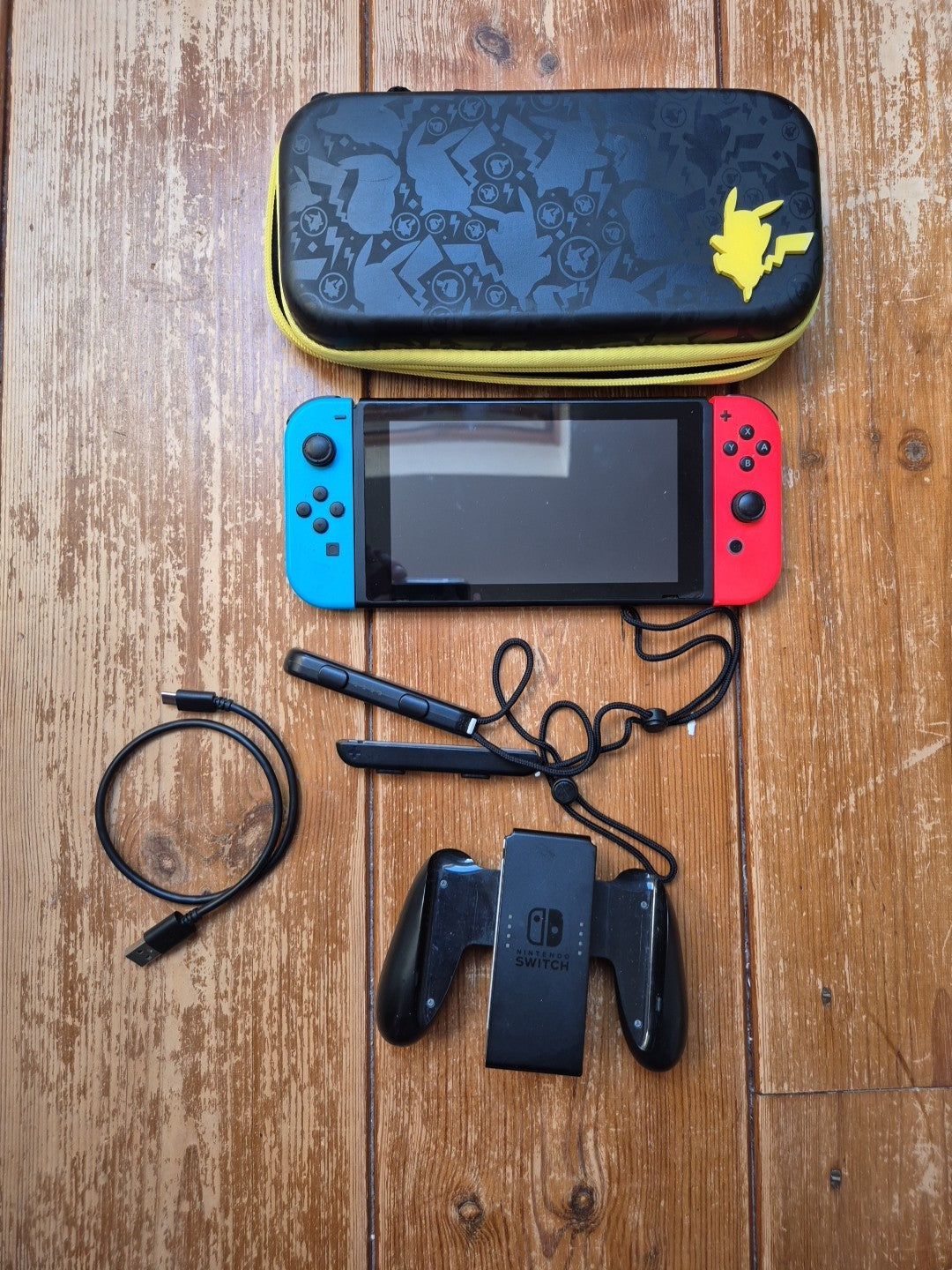 Nintendo Switch With Grip, Charger Cable And Pokemon Carry Case